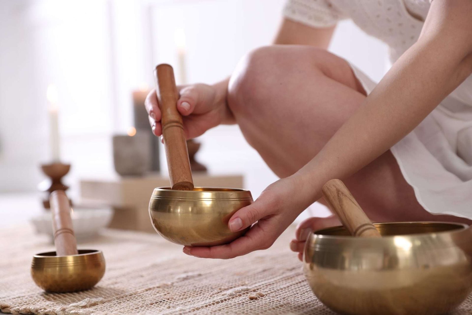 Woman,With,Singing,Bowls,On,Floor,Indoors,,Closeup